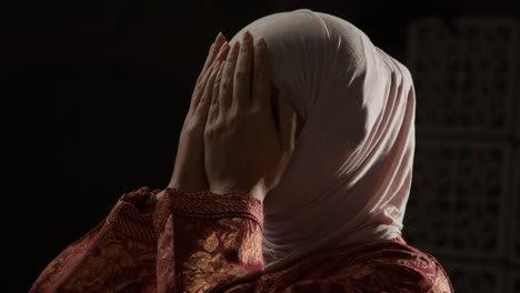 Studio-Head-And-Shoulders-Portrait-Of-Muslim-Woman-Wearing-Hijab-Praying-6